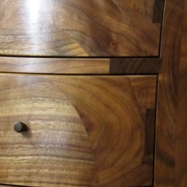 Shaping thick layers of solid wood produced these parabolas in the drawer fronts.
